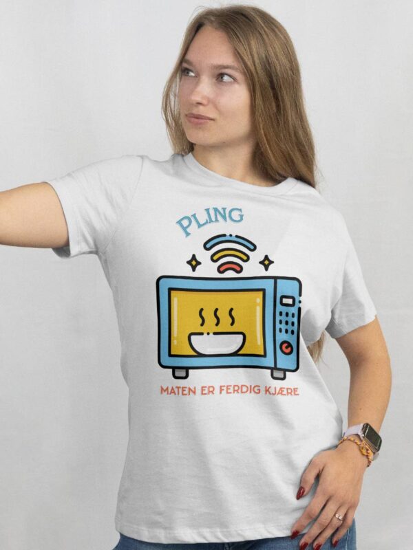 a woman wearing a white shirt with a cartoon on it